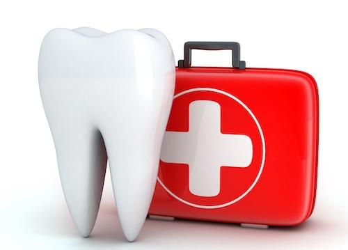 tooth next to a first aid kit