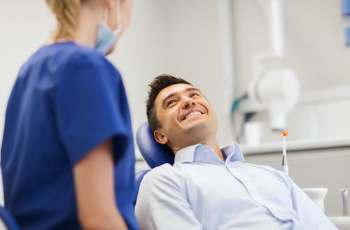 man smiling after emergency dental care in duncan