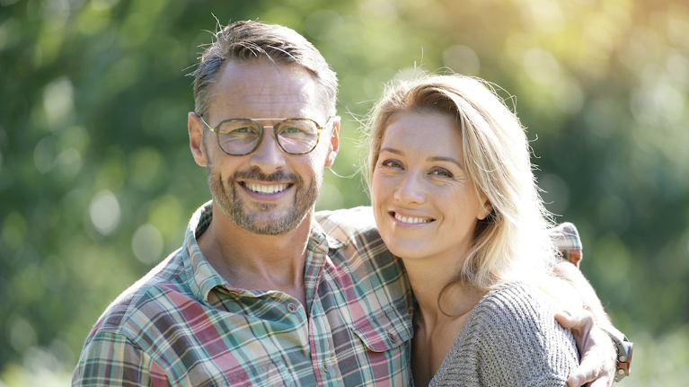 man and woman smiling