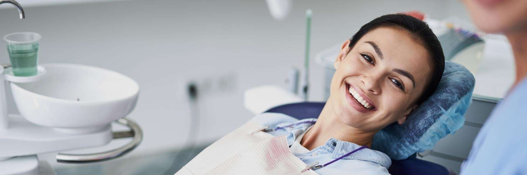 Duncan woman smiling in dental chair after dental implants