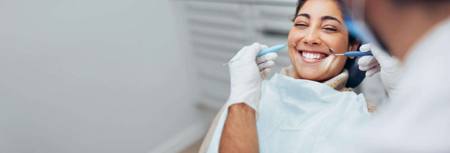 woman smiling after a tooth extraction in duncan